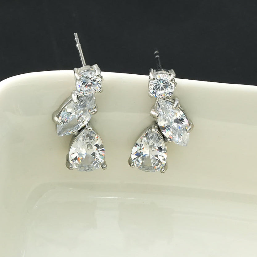 THEOLA: Radiance Triple Moissanite Stack Stud Earrings in Silver Toned White Gold