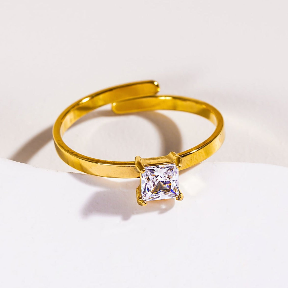 Style ADHIKA 2895: Classic Gold Ring with a Square Zirconia Centerpiece.