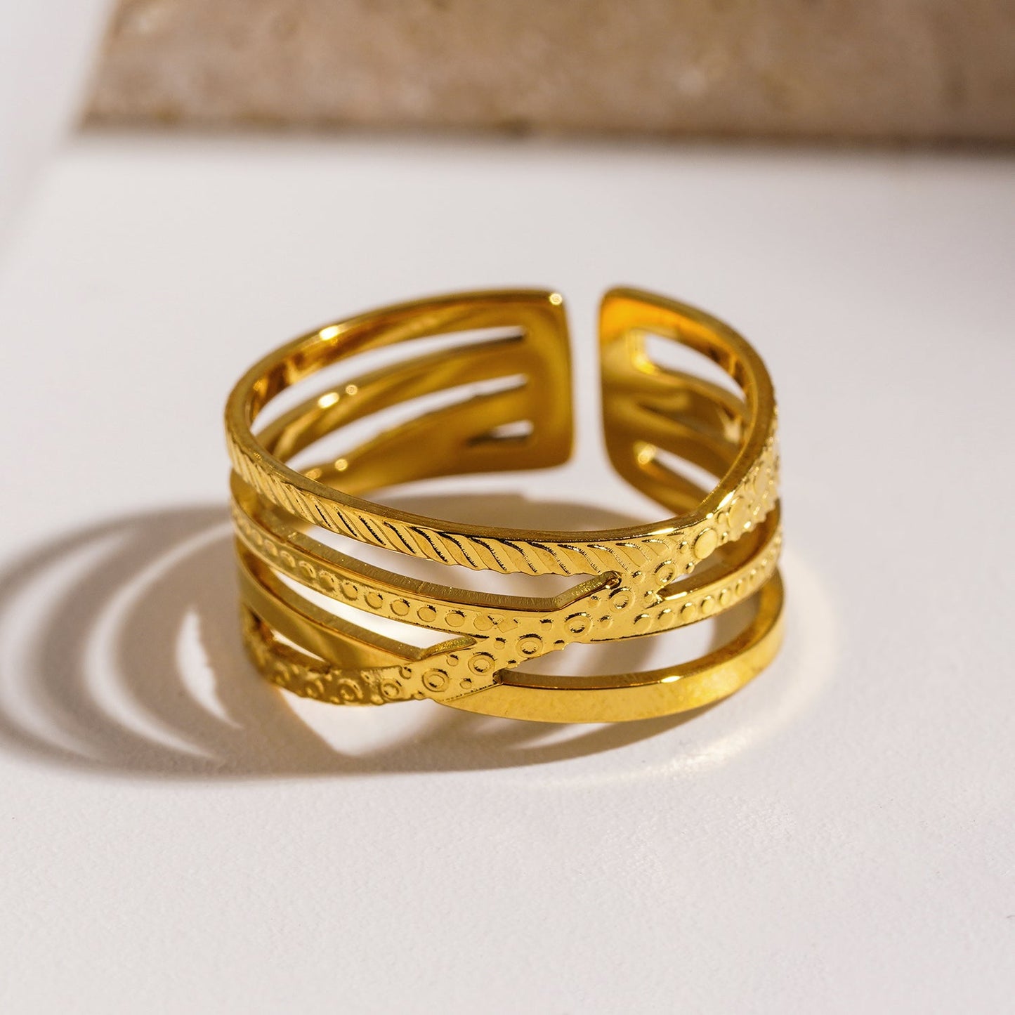 Style ALOIS 7793: Cross Over Multi Stacked Textured Gold Ring.