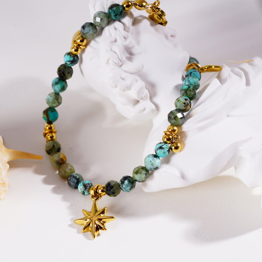 Style KAVYA 8090: Blue Turquoise Stones with Gold Beads & Charms Chain Bracelet.