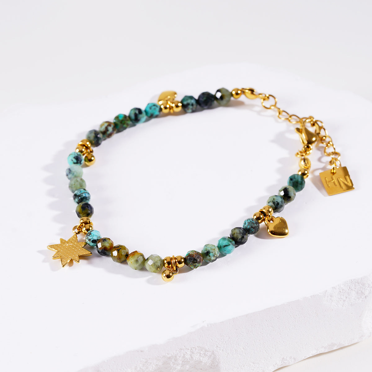 Style KAVYA 8090: Blue Turquoise Stones with Gold Beads & Charms Chain Bracelet.