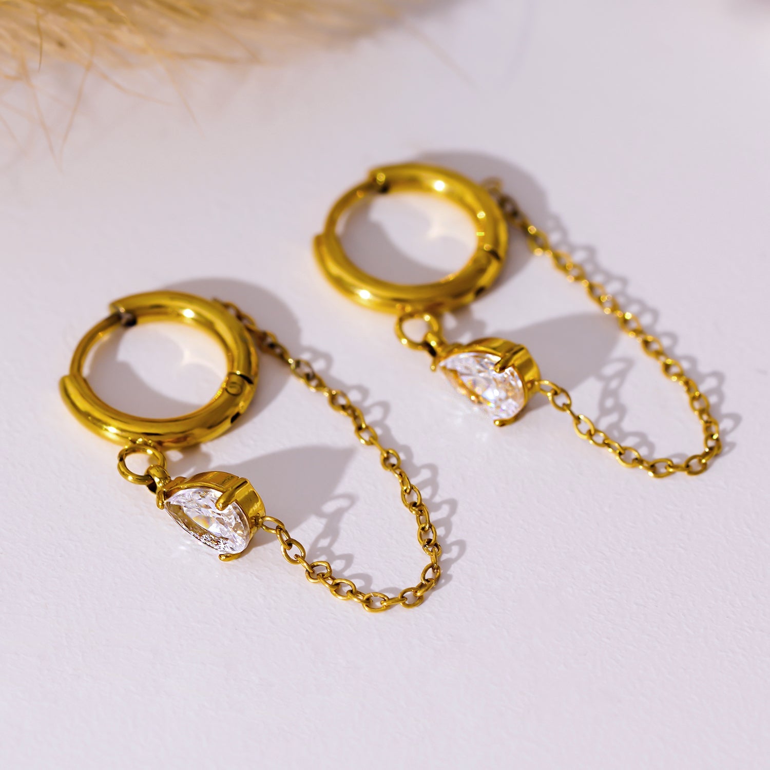 Style KAZUKA 8726: Hoop Earrings with Pear-Shaped Zirconia Charm and Dainty Chain.