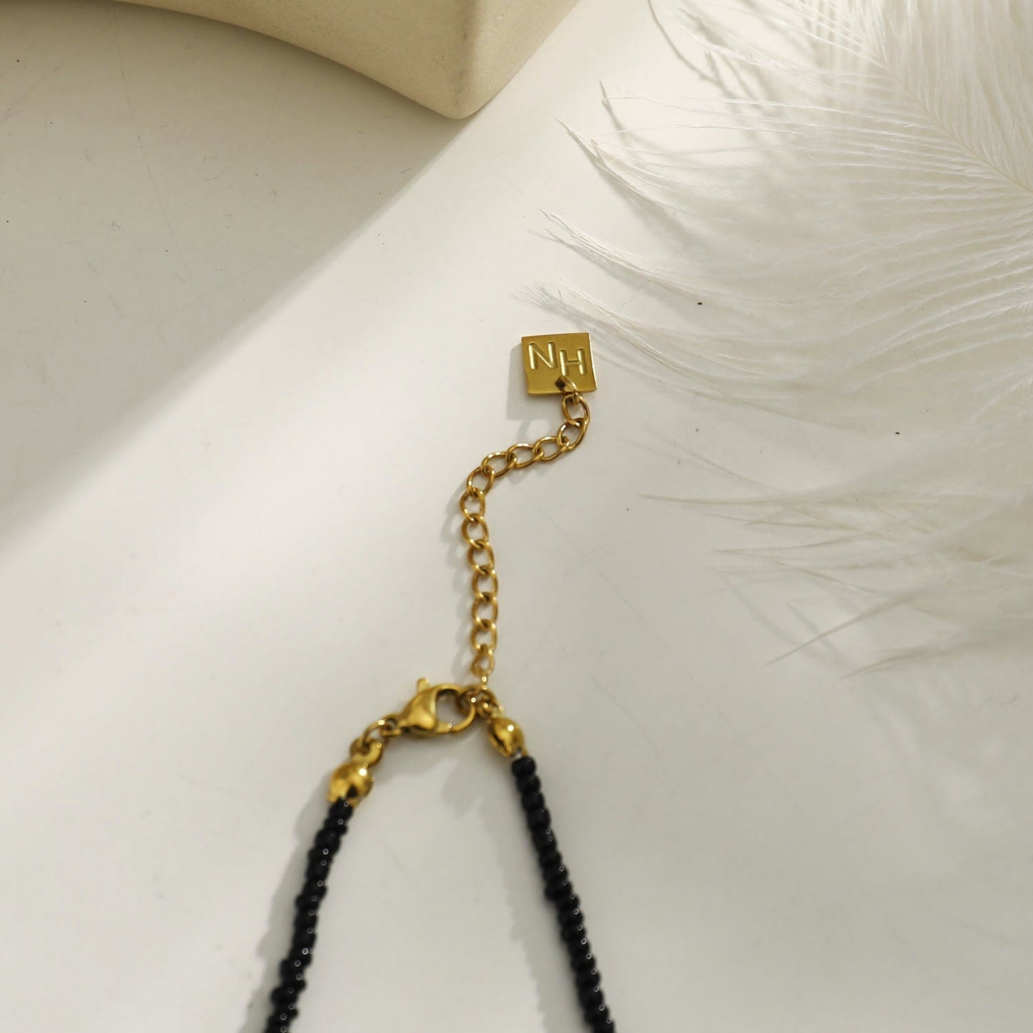 RITA Black & Gold Beaded Chain Necklace with Etched Gold Tooth Pendant