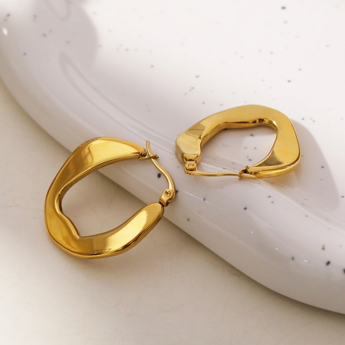 CALIXIA "Sculpted Sophistication: Discover the Allure of Geometric Irregular Hoop Earrings!".