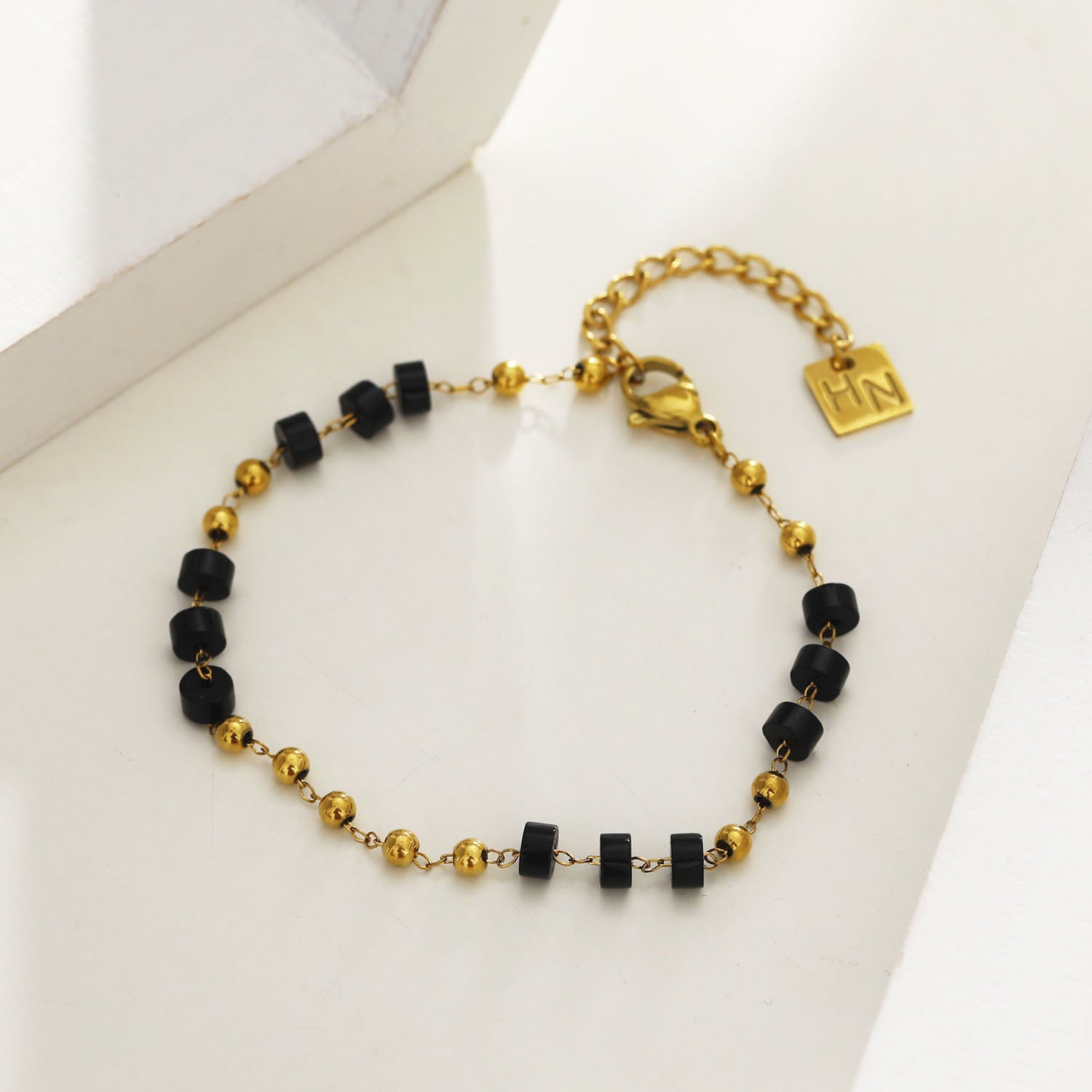 Style: ROSARIO 22108 Black Onyx and Gold Beaded Chain Bracelet.