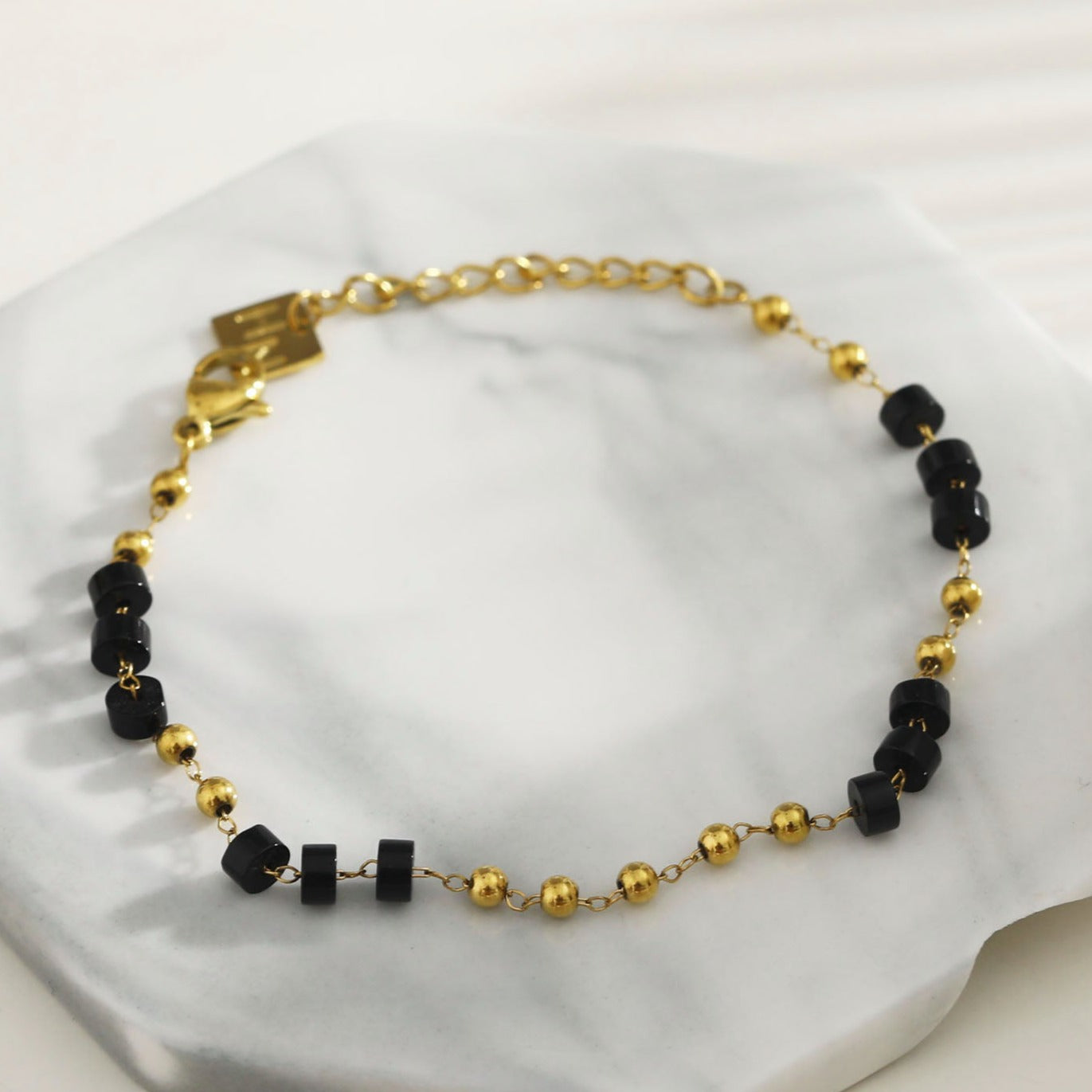 Style: ROSARIO 22108 Black Onyx and Gold Beaded Chain Bracelet.